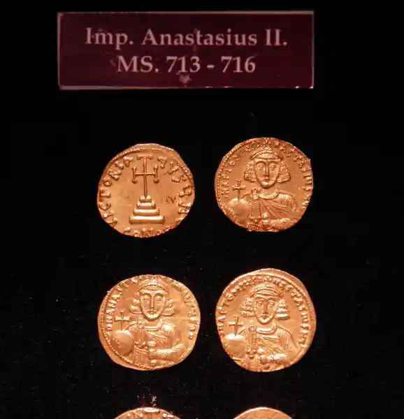 Asymmetrical cross on Emperor Anastasius II coin, dated 713-716, located at Archaeological Museum of Izmir, Turkey